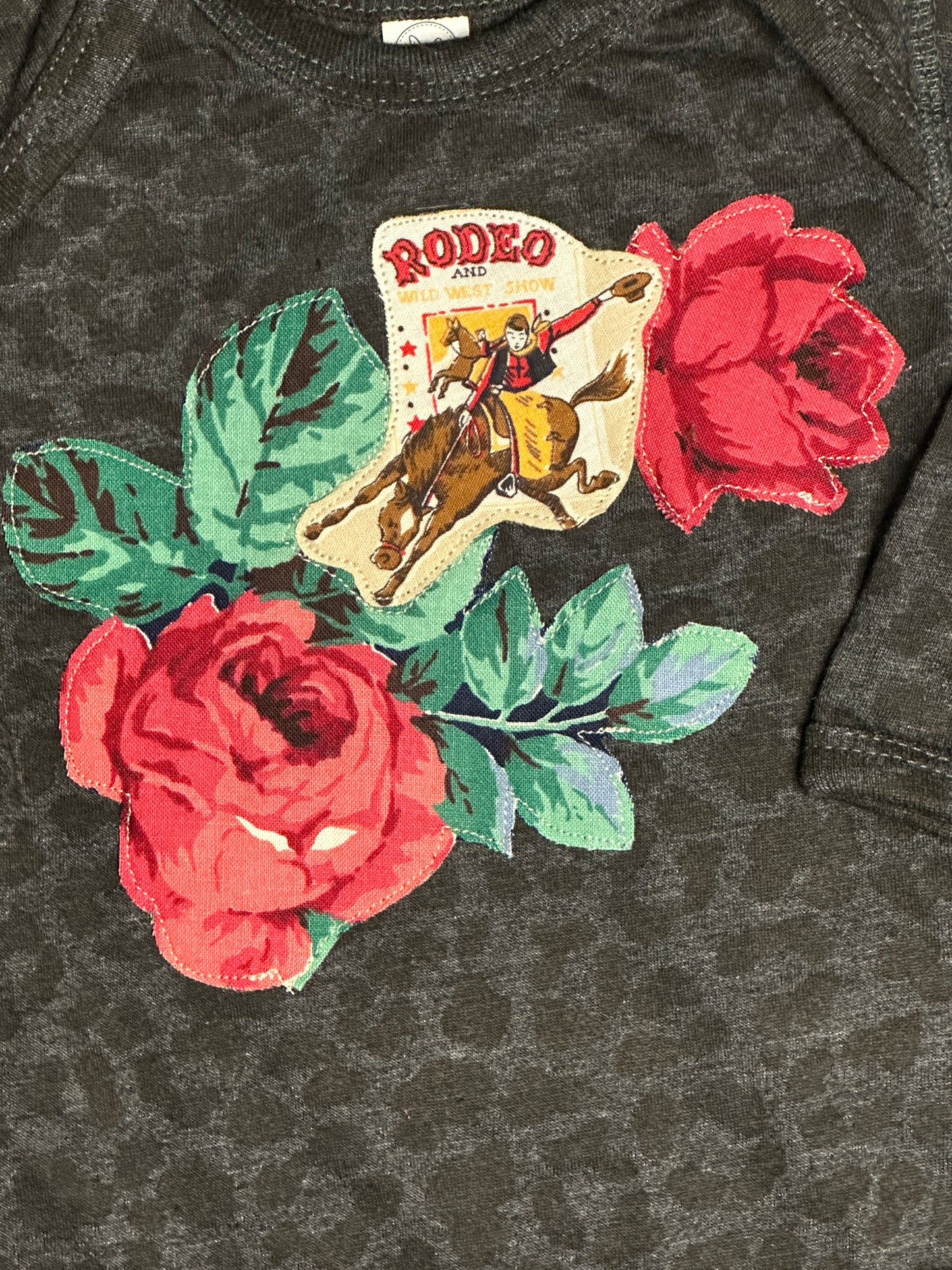 Vintage Rodeo Poster & Roses on Long Sleeve Black Leopard Onesie, Size 12 mons.