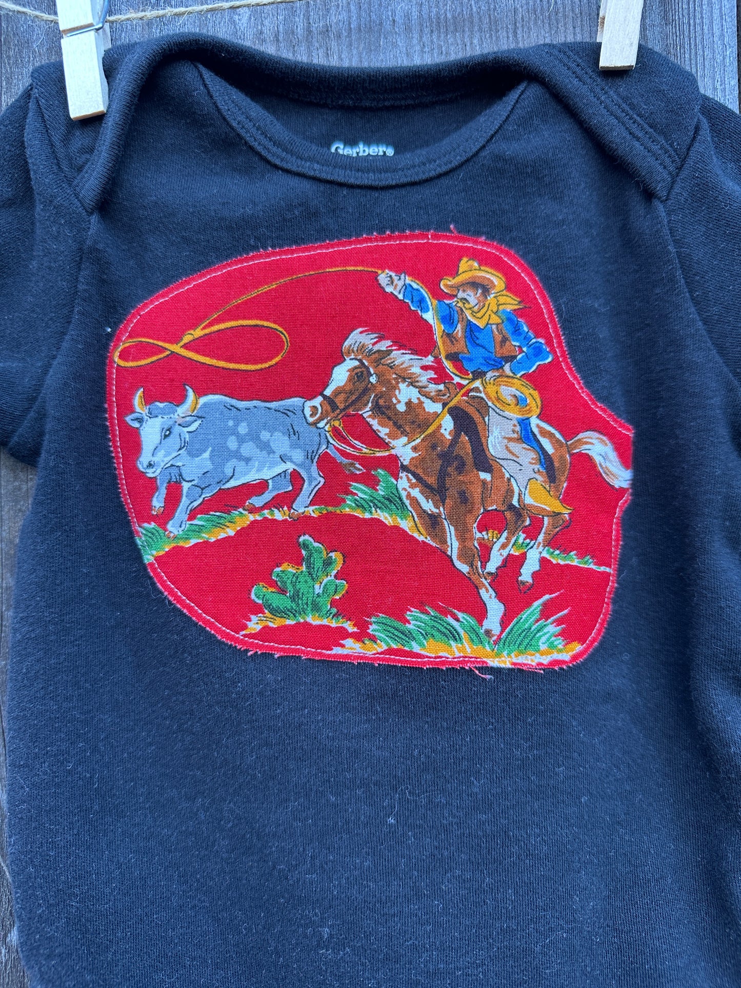 Steer Roper on Black Onesie, Size 12 mons.