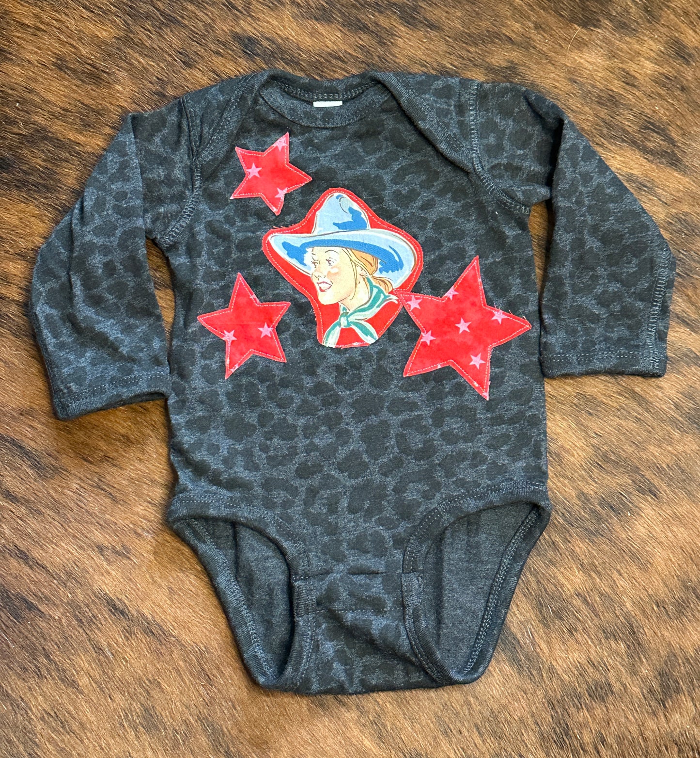 She’s a Star Black Leopard Long Sleeve Onesie, Size 6 mons.
