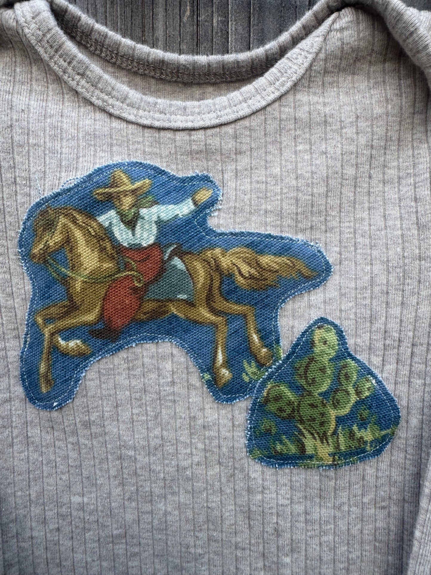 Ribbed Light Tan Onesie with Blue Cowboy, Size 18 mons.