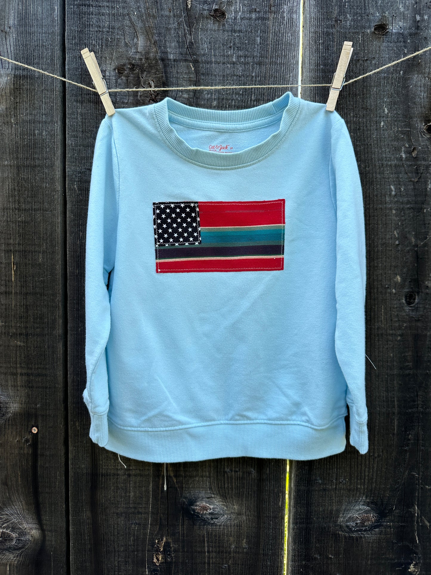 Red Serape Flag on Light Blue Sweatshirt, Size 5T