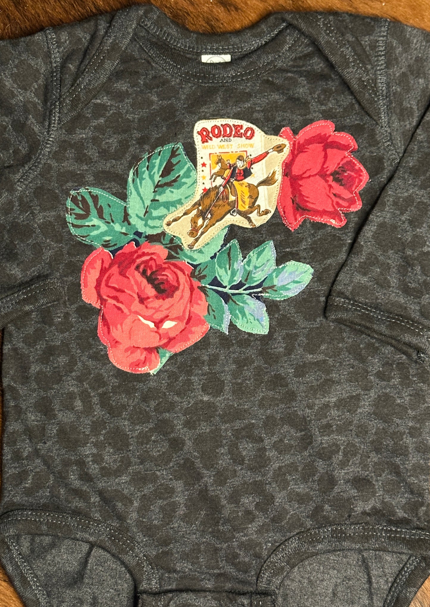Vintage Rodeo Poster & Roses on Long Sleeve Black Leopard Onesie, Size 12 mons.