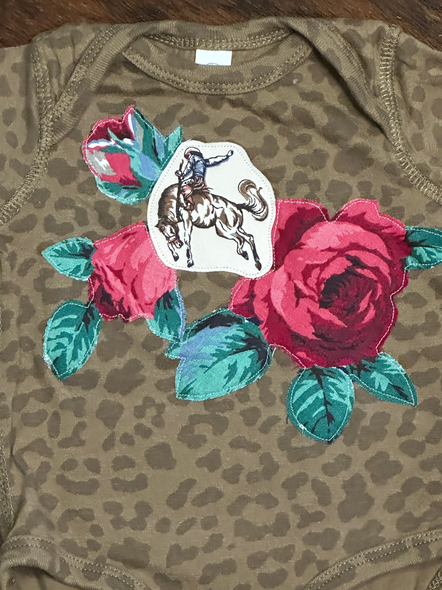 Bronc Rider & Roses on Brown Leopard Onesie, Size 6 mons.