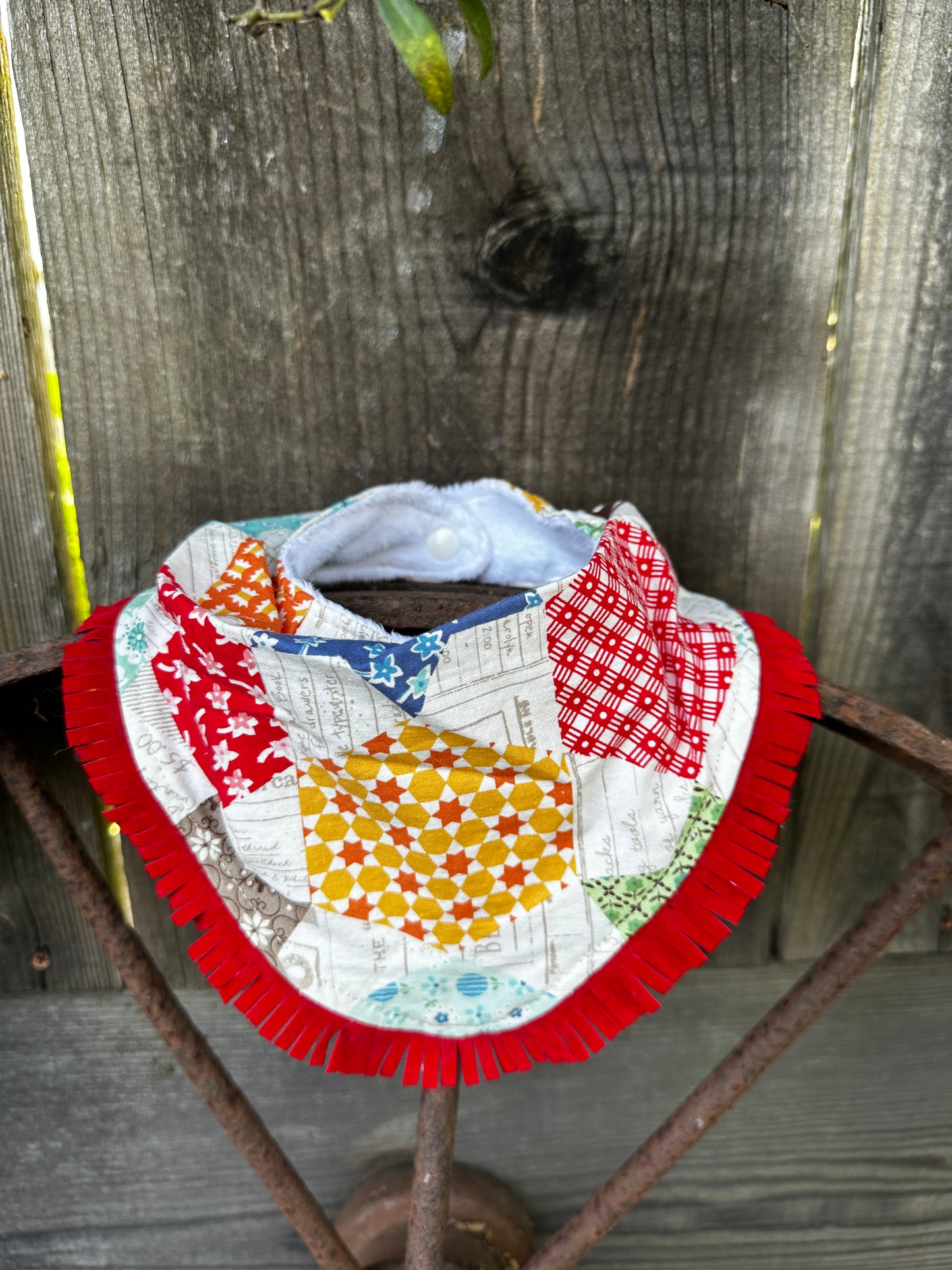 Colorful Quilt-Look Buckaroo Baby Bib with Red Fringe
