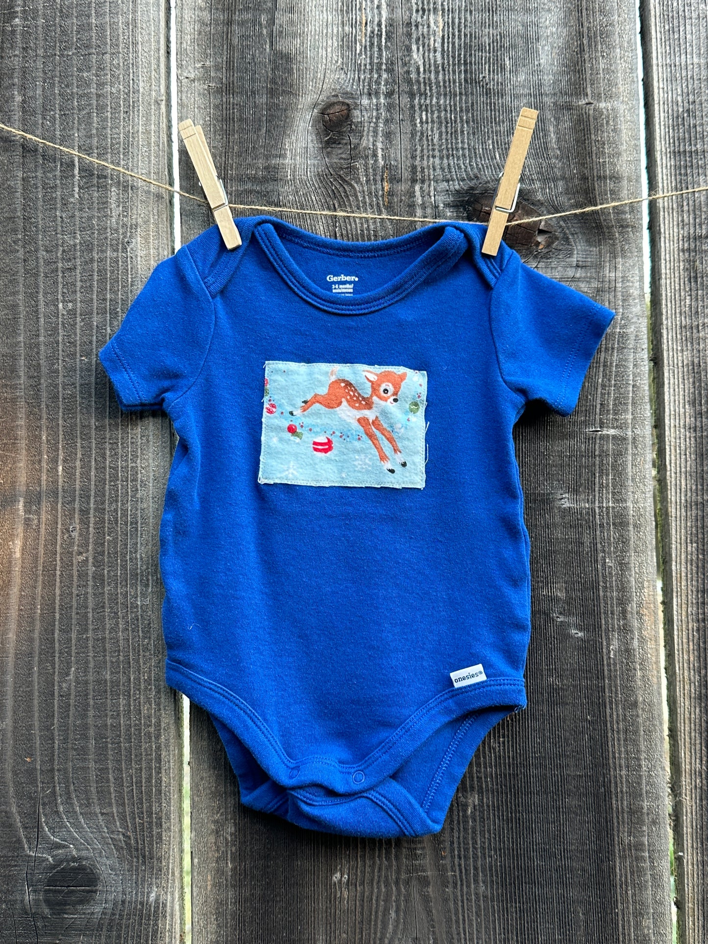 Reindeer Games Blue Onesie, Size 3-6 mons.