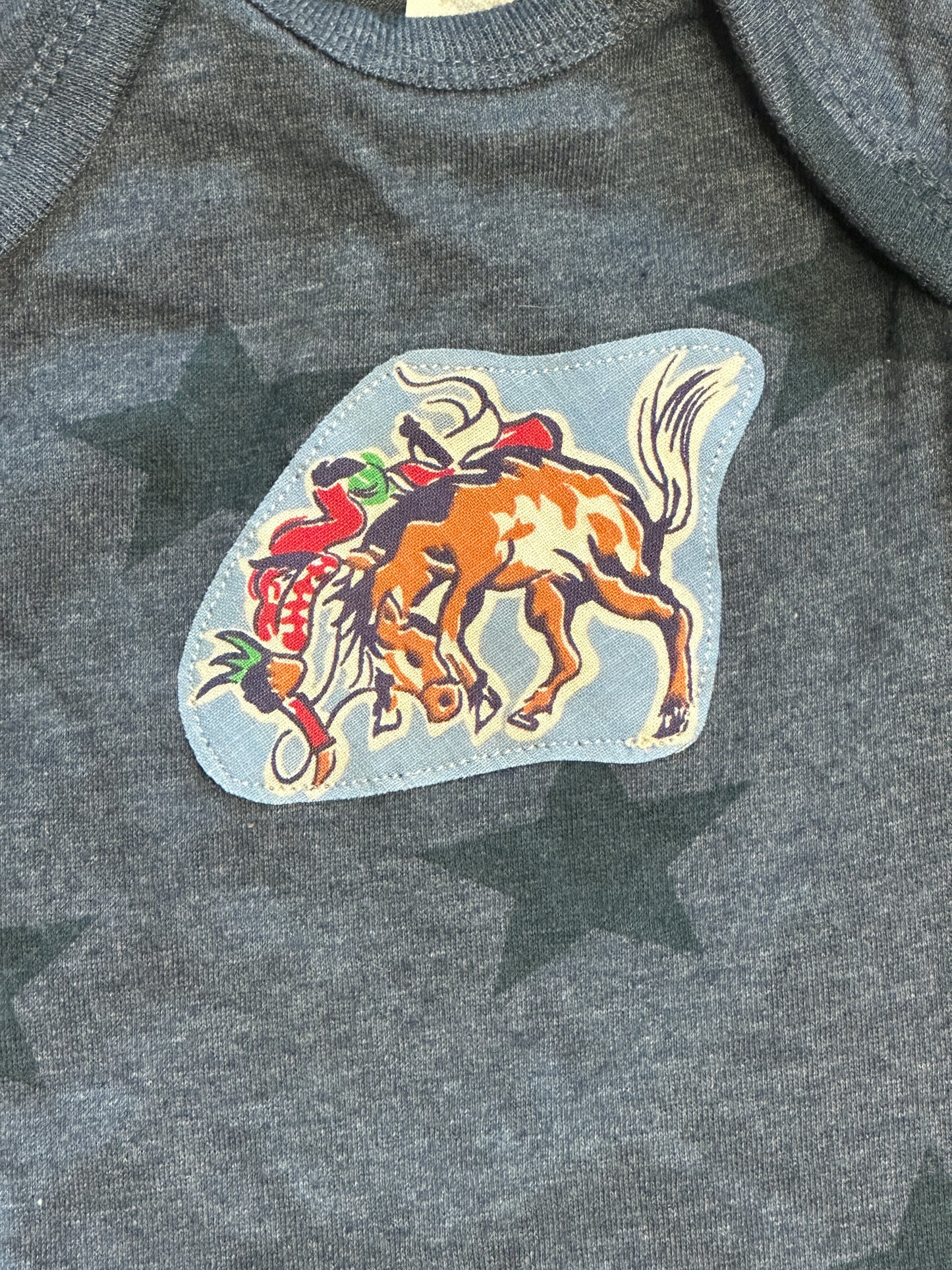Riding for a Fall Blue Heathered Star Onesie, Size Newborn