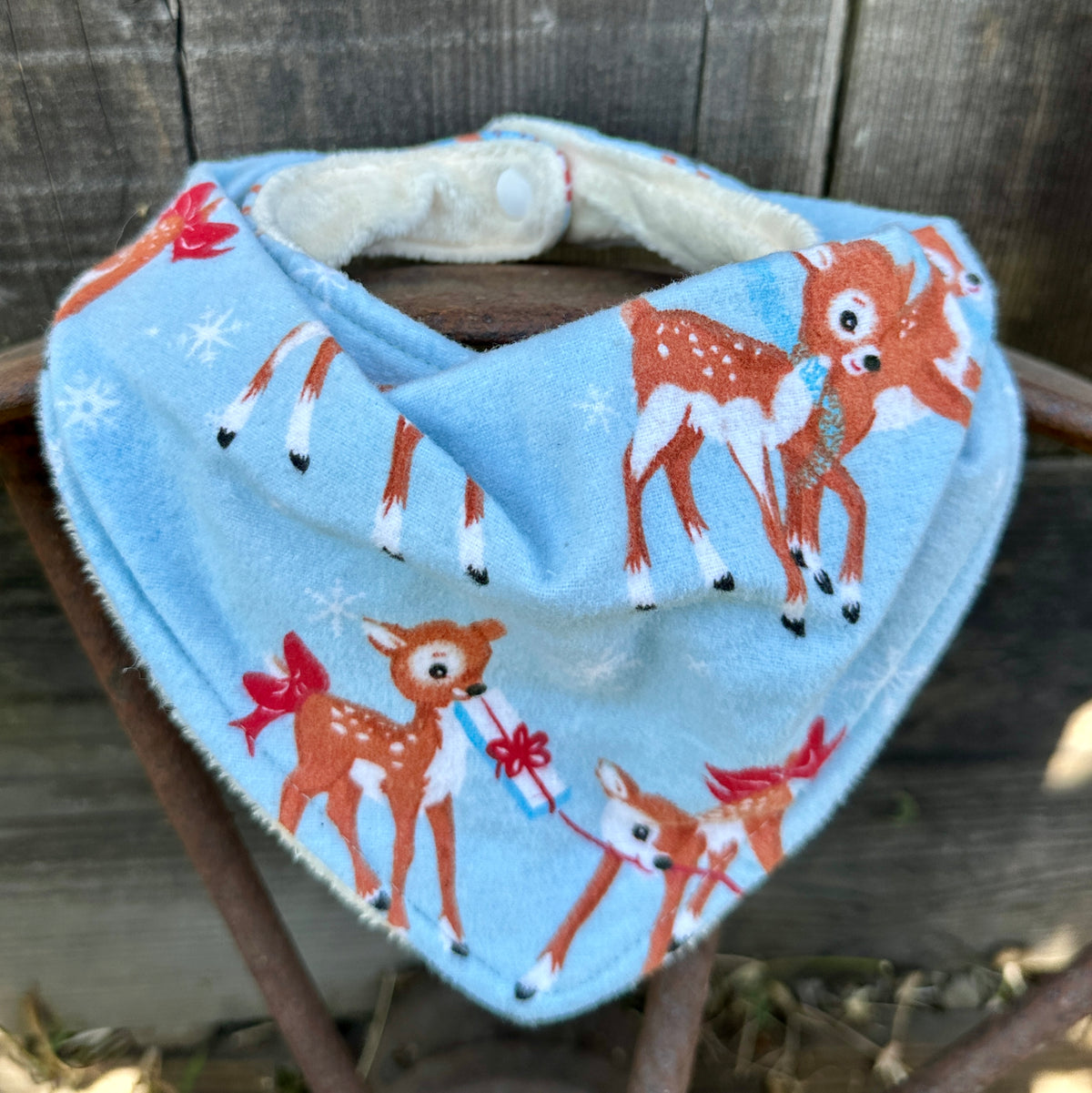 Wrapping Reindeer Flannel Christmas Bib
