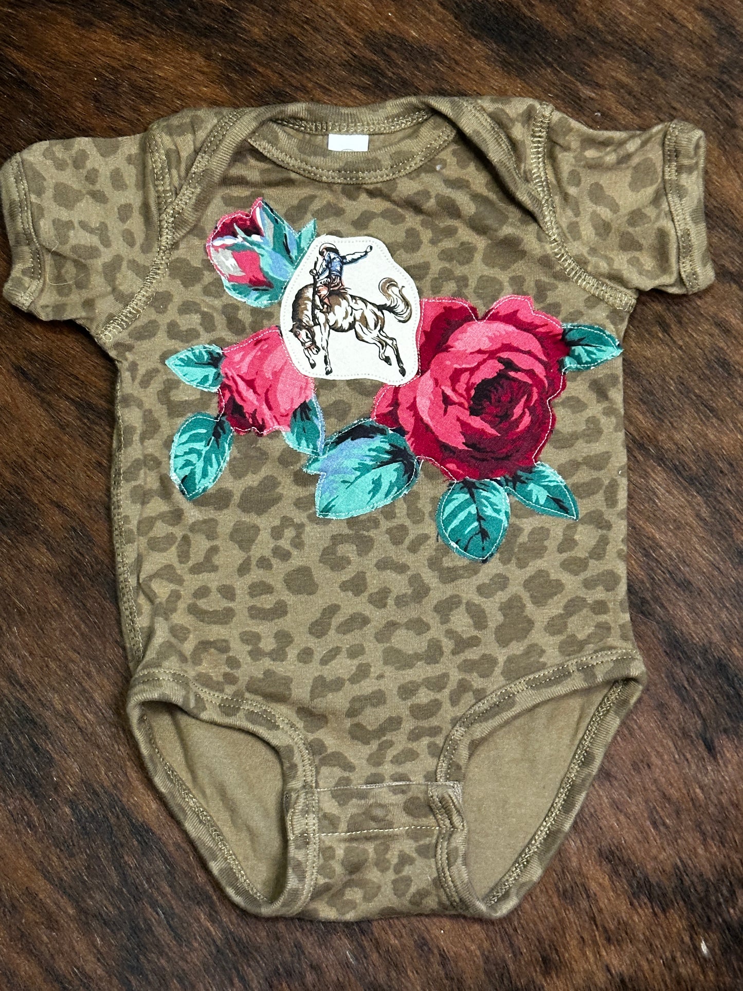 Bronc Rider & Roses on Brown Leopard Onesie, Size 6 mons.