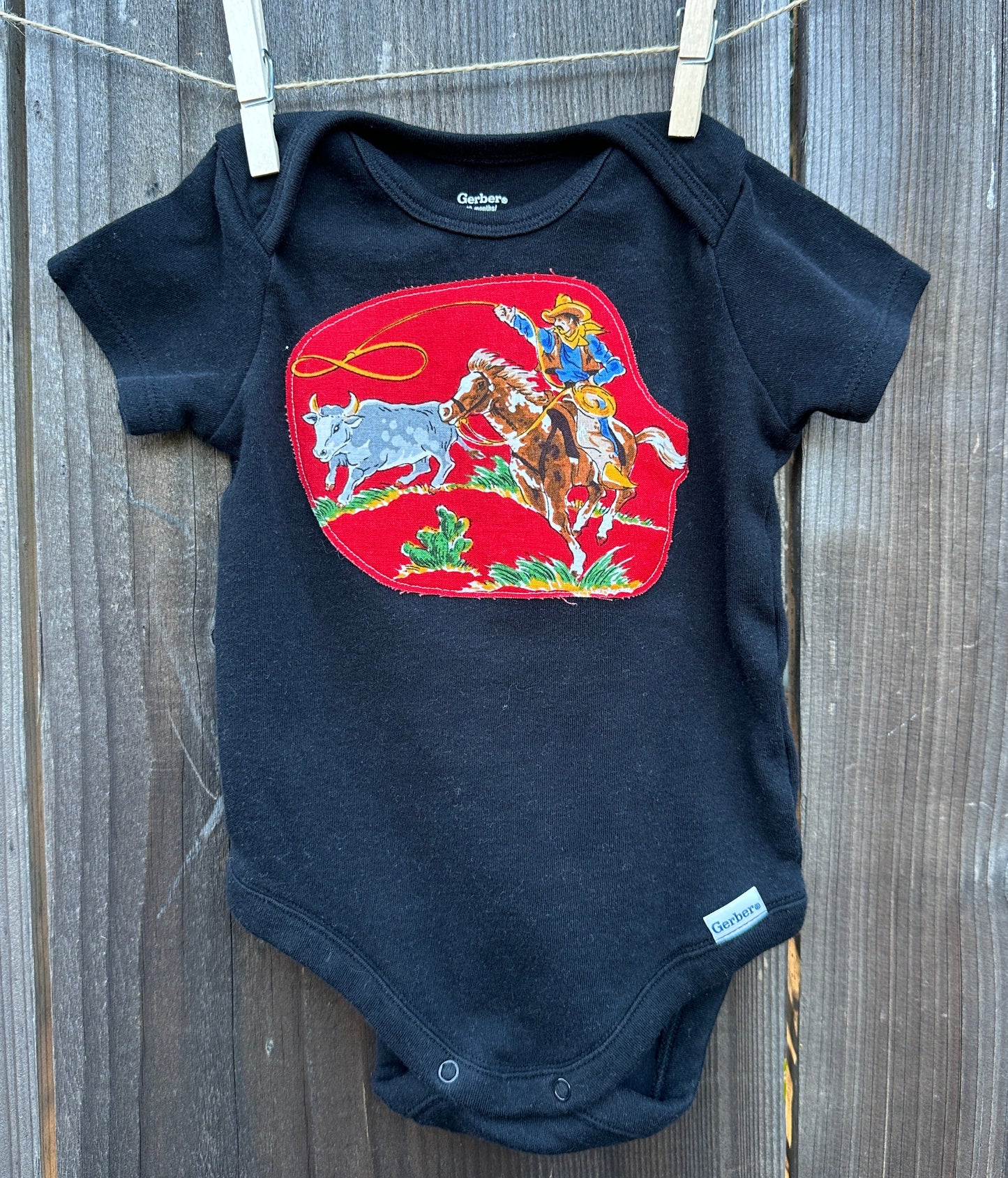 Steer Roper on Black Onesie, Size 12 mons.