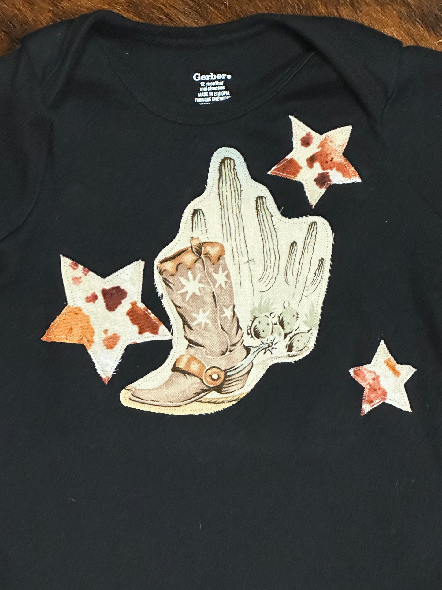 Southwest Scene & Cowhide Print Stars on Black Onesie, Size 12 mons.
