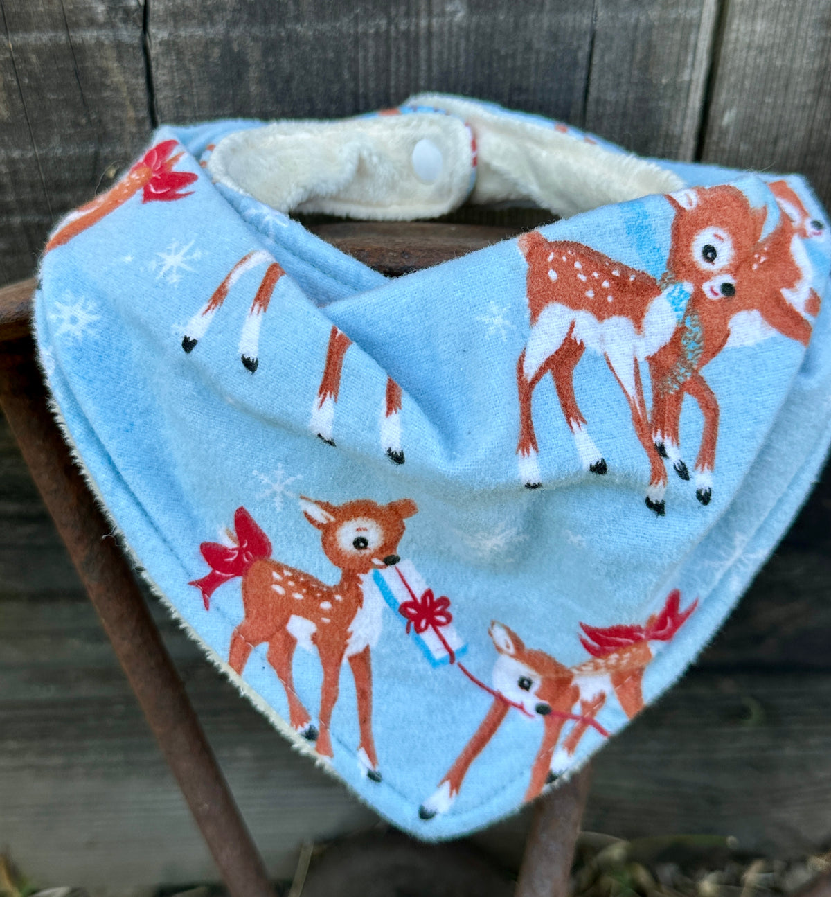 Wrapping Reindeer Flannel Christmas Bib
