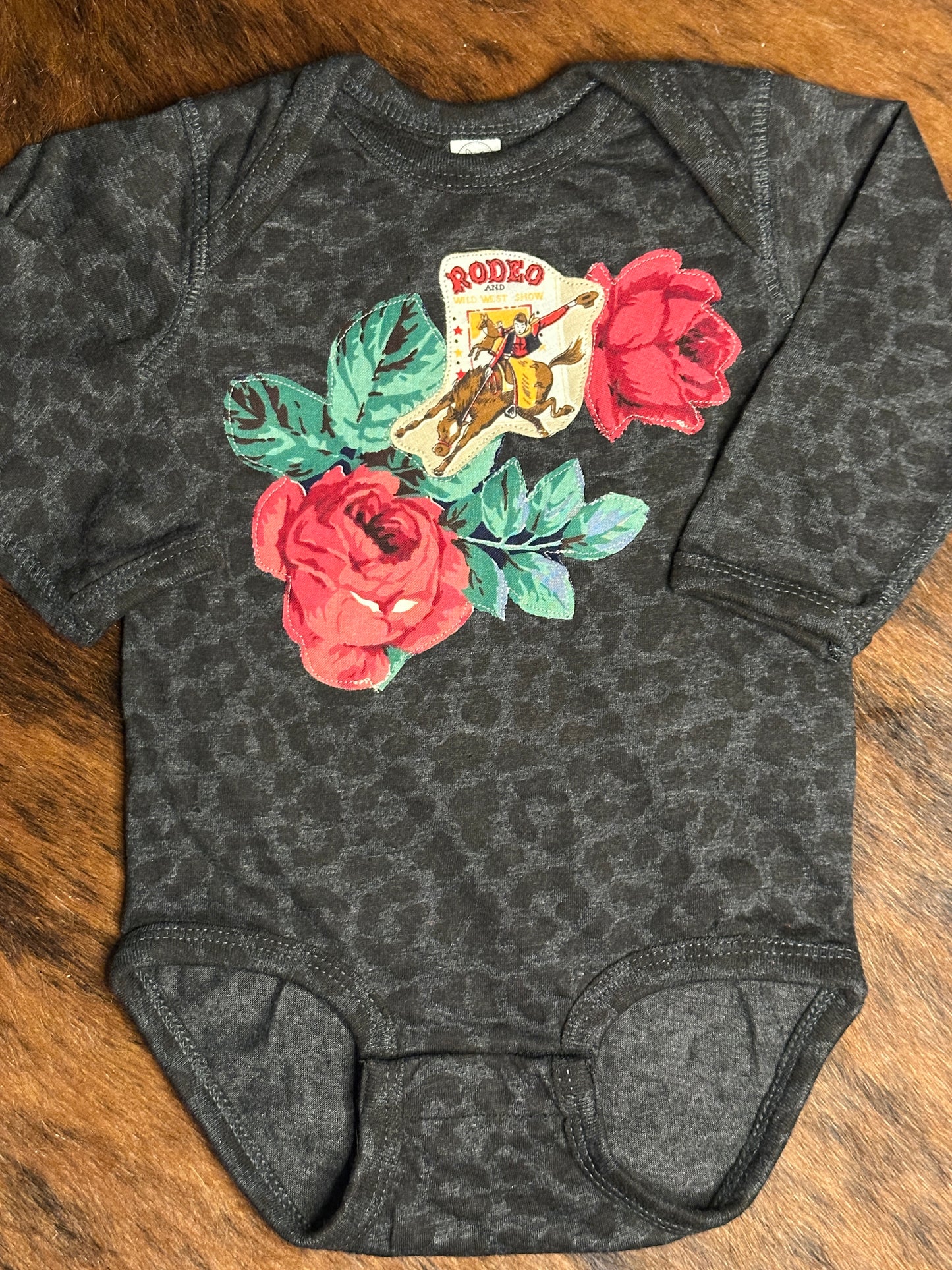 Vintage Rodeo Poster & Roses on Long Sleeve Black Leopard Onesie, Size 12 mons.