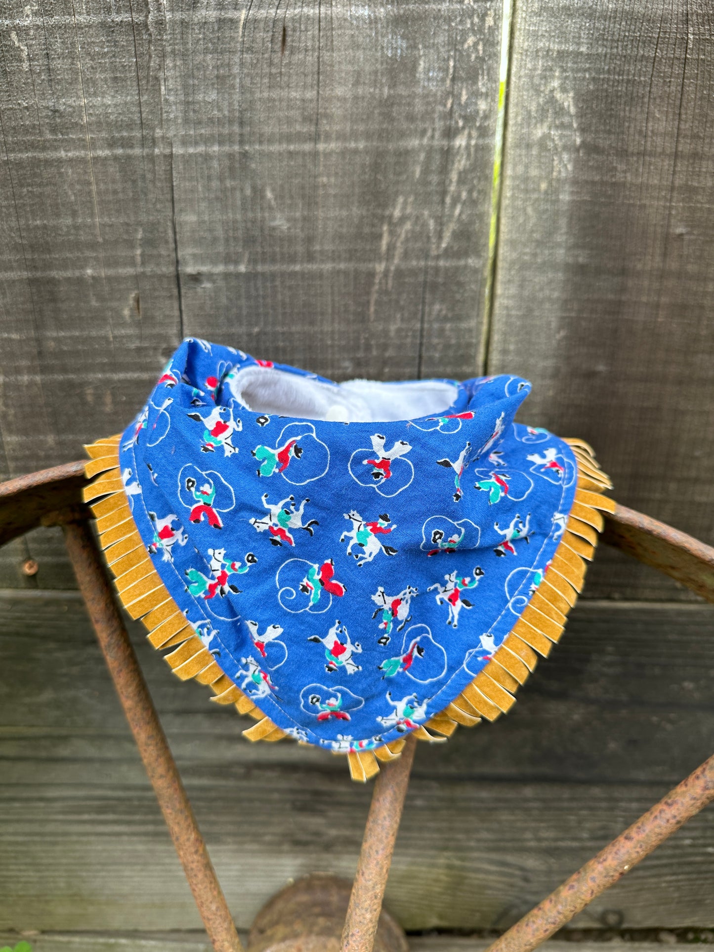 Blue Tiny Vintage Cowboys and Trick Ropers Buckaroo Baby Bib