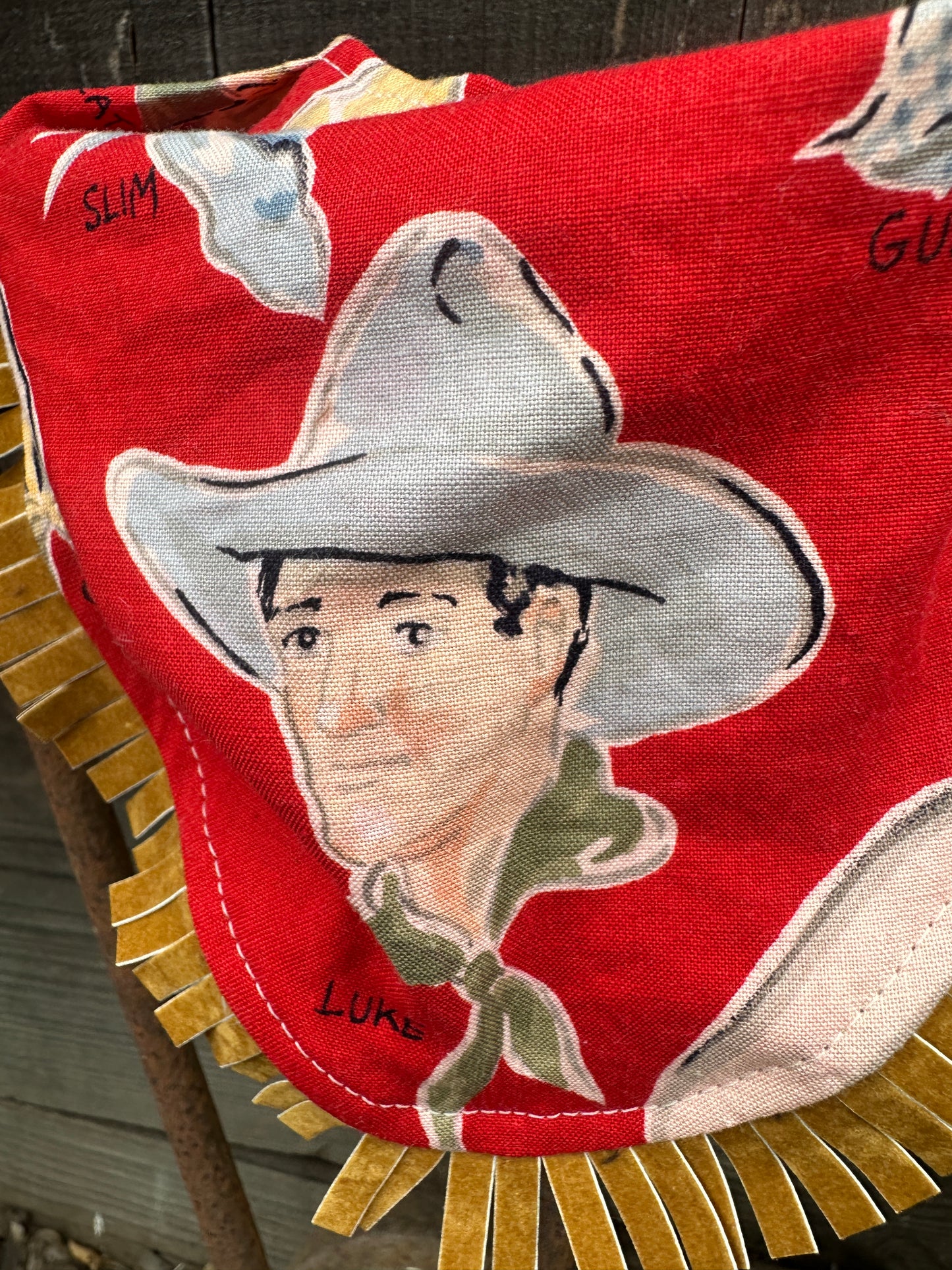 Cowboy Luke on Red Buckaroo Baby Bib