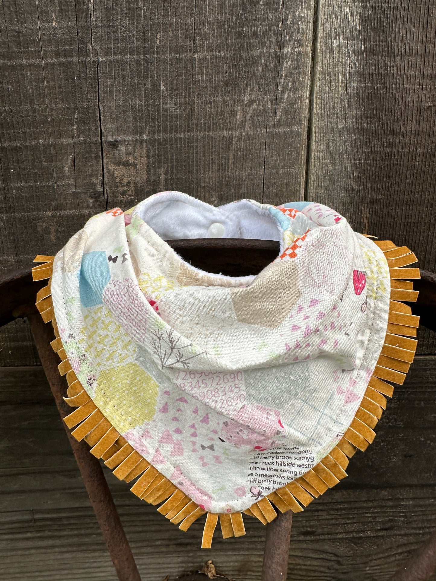 Quilted Pastel Print Buckaroo Baby Bib; Available with & without Fringe