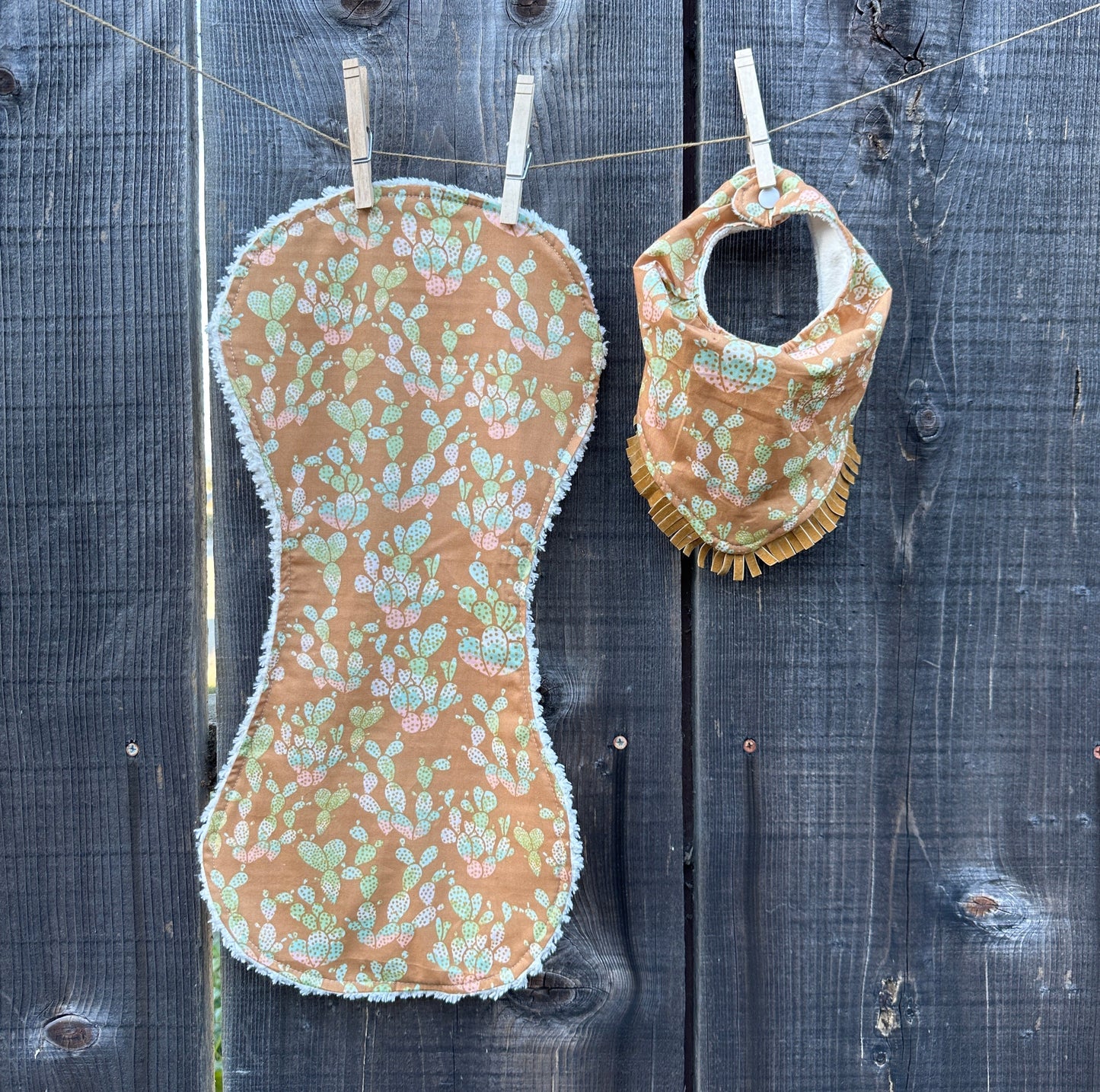 Prickly Pear Cacti in Sunset Tones with Metallic Dots Buckaroo Baby Bibs Set