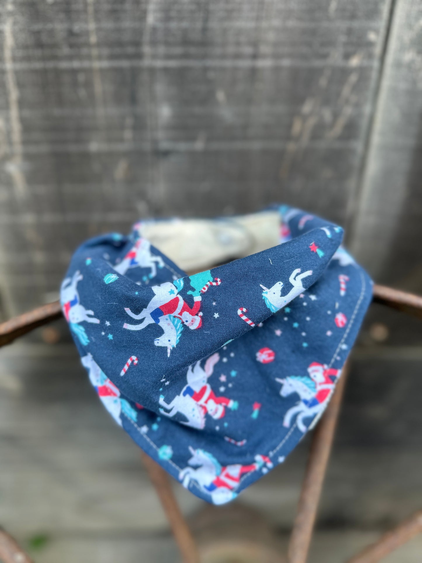 Navy Santa Riding Unicorn Buckaroo Baby Bib