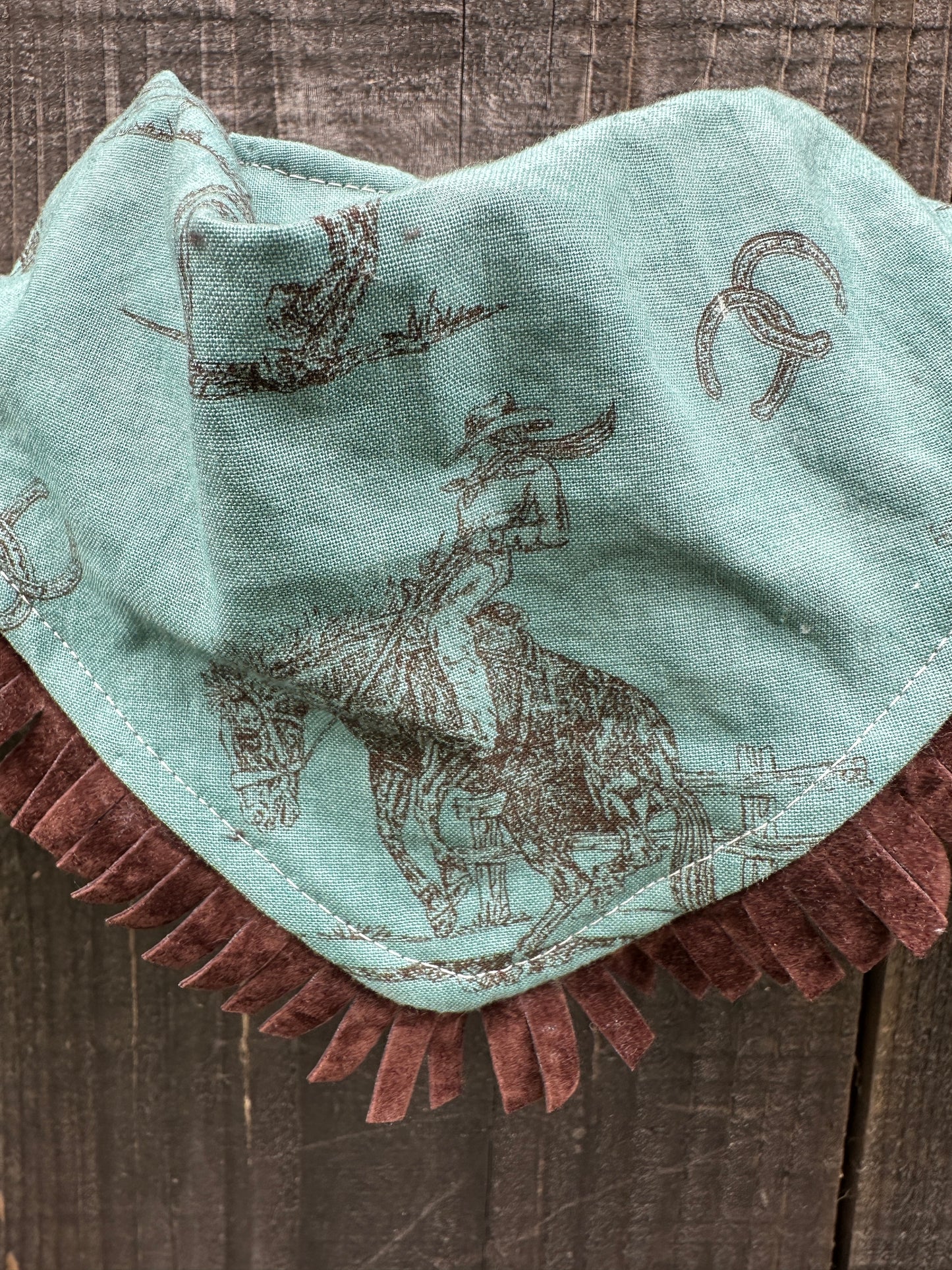 Cowgirl Bronc Rider on Turquoise Buckaroo Baby Bib